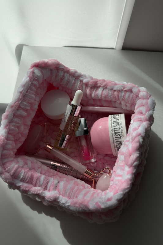 Pink knit pouch open – studio