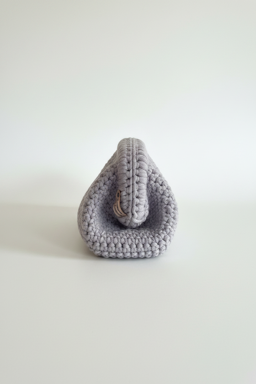Grey pouch close-up with tag – studio